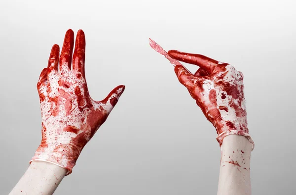 Bloody hands in gloves with the scalpel, white background, isolated, doctor, killer, maniac — Stock Photo, Image