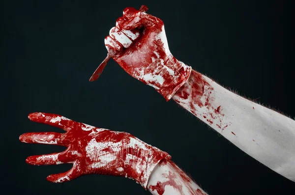 Bloody hands in gloves with the scalpel, black background, isolated, doctor, killer, maniac — Stock Photo, Image