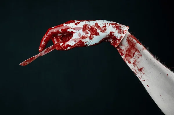 Bloody hands in gloves with the scalpel, black background, isolated, doctor, killer, maniac — Stock Photo, Image