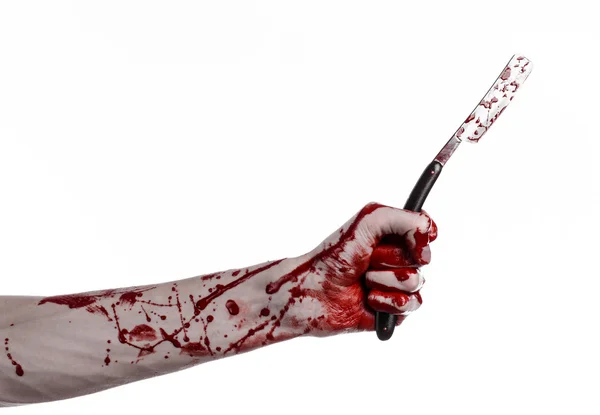 Bloody Halloween theme: bloody hand holds a razor sharp old with a dangerous edge isolated on white background — Stock Photo, Image