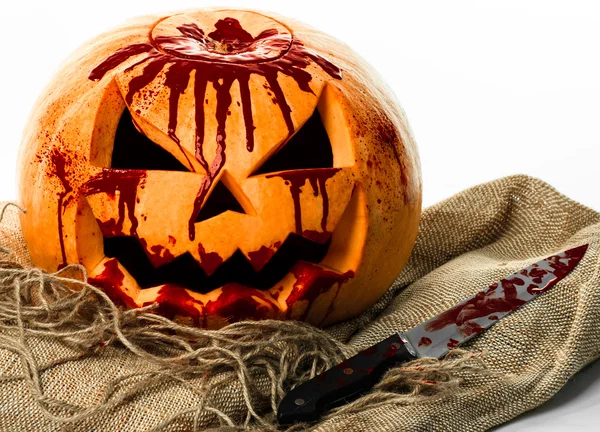 Bloody pumpkin, jack lantern, pumpkin halloween, halloween theme, pumpkin killer, bloody knife, bag, rope, white background, isolated — Stock Photo, Image