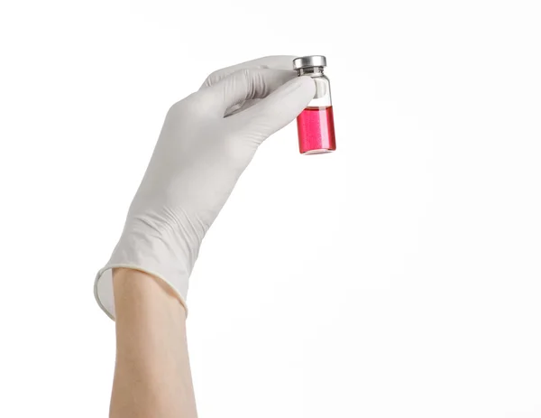 Medical theme: doctor's hand in a white glove holding a red vial of liquid for injection isolated on white background — Stock Photo, Image