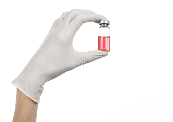 Medical theme: doctor's hand in a white glove holding a red vial of liquid for injection isolated on white background — Stock Photo, Image