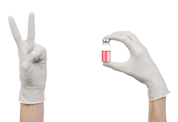 Medical theme: doctor's hand in a white glove holding a red vial of liquid for injection isolated on white background — Stock Photo, Image