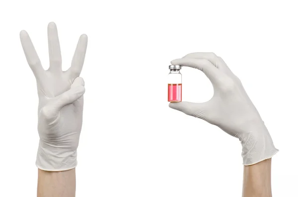 Medical theme: doctor's hand in a white glove holding a red vial of liquid for injection isolated on white background — Stock Photo, Image