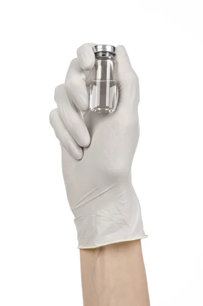 Medical theme: doctor's hand in a white glove holding a vial of clear liquid for injection isolated on white background — Stock Photo, Image