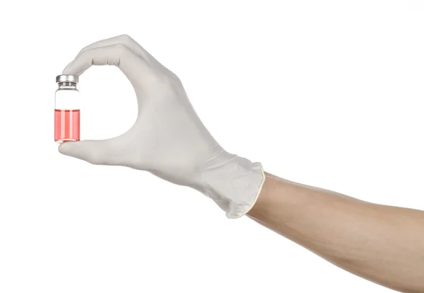 Medical theme: doctor's hand in a white glove holding a red vial of liquid for injection isolated on white background — Stock Photo, Image