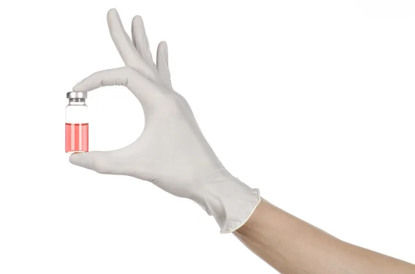 Medical theme: doctor's hand in a white glove holding a red vial of liquid for injection isolated on white background — Stock Photo, Image