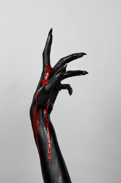 Bloody black hands of death — Stock Photo, Image