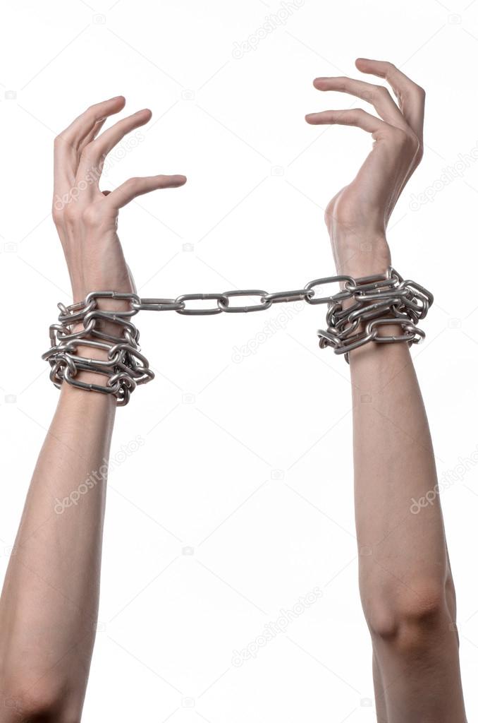 Social theme: hands tied a metal chain on a white background