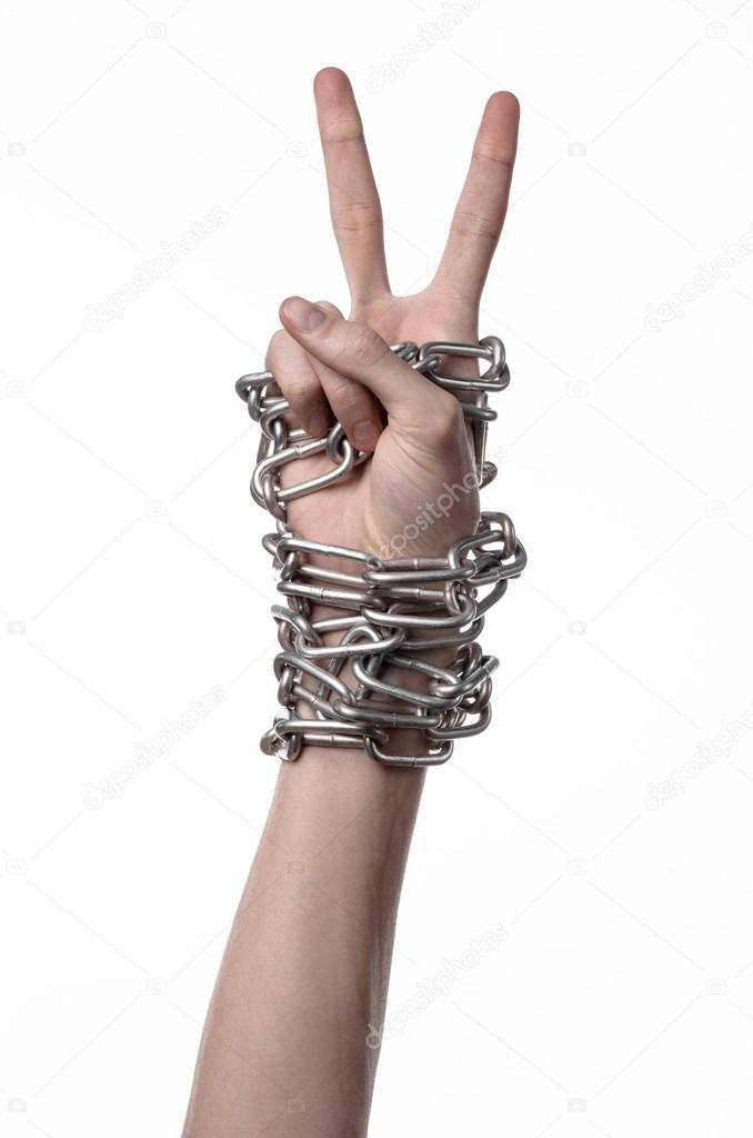 Social theme: hands tied a metal chain on a white background