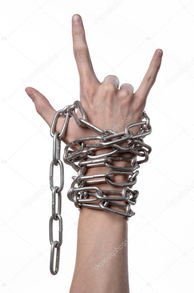 Social theme: hands tied a metal chain on a white background