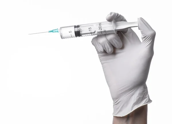 Doctor's hand holding a syringe, white-gloved hand, a large syringe, medical issue, the doctor makes an injection, white background, isolated, white gloves doctor — Stock Photo, Image