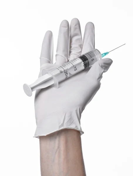 Doctor's hand holding a syringe, white-gloved hand, a large syringe, medical issue, the doctor makes an injection, white background, isolated, white gloves doctor — Stock Photo, Image