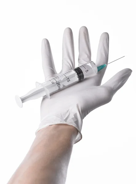 Doctor's hand holding a syringe, white-gloved hand, a large syringe, medical issue, the doctor makes an injection, white background, isolated, white gloves doctor — Stock Photo, Image