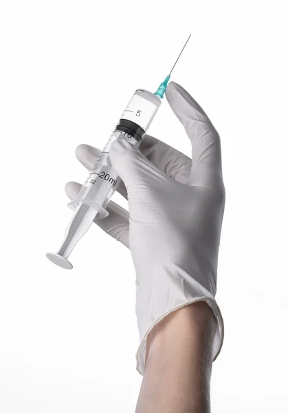 Doctor's hand holding a syringe, white-gloved hand, a large syringe, medical issue, the doctor makes an injection, white background, isolated, white gloves doctor — Stock Photo, Image