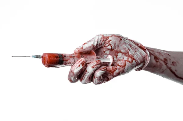 Bloody hand holding a syringe, bloody hands of the doctor, bloody syringe, large syringe, doctor killer, mad doctor, bloody gloves, bloody theme, white background, isolated — Stock Photo, Image