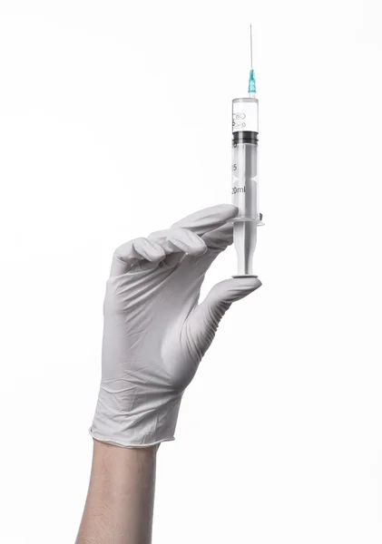 Doctor's hand holding a syringe, white-gloved hand, a large syringe, medical issue, the doctor makes an injection, white background, isolated, white gloves doctor — Stock Photo, Image