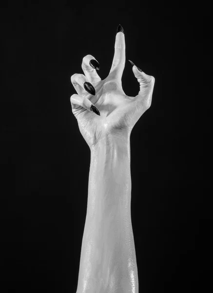 White hands of death with black nails, white death, the devil's hands, the hands of a demon, white skin, halloween theme, black background, isolated — Stock Photo, Image