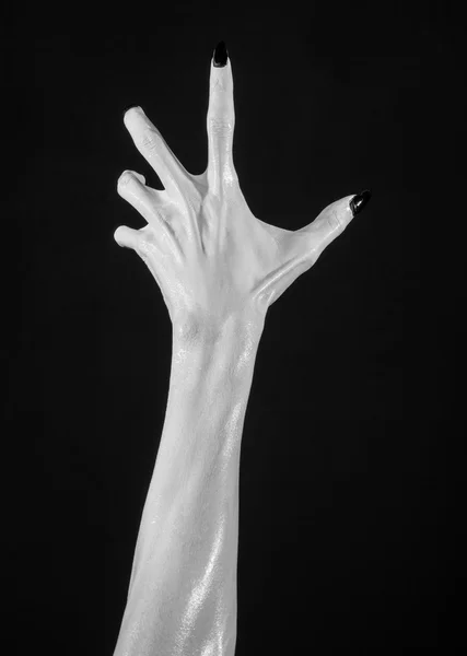 white hands of death with black nails, white death, the devil's hands, the hands of a demon, white skin, halloween theme, black background, isolated