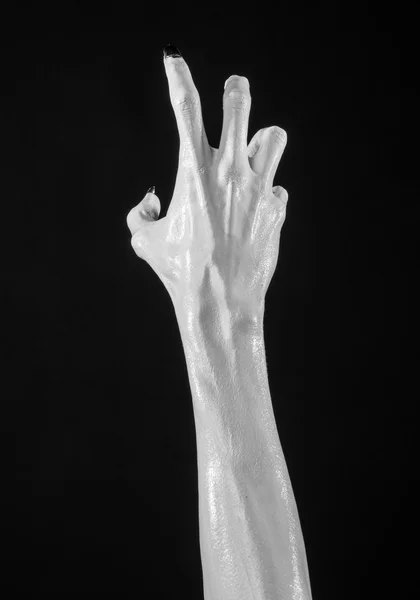 White hands of death with black nails, white death, the devil 's hands, the hands of a demon, white skin, halloween theme, black background, isolated — стоковое фото