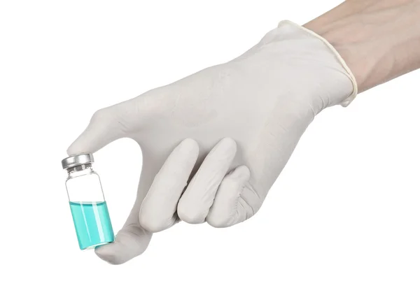 Medical theme: doctor's hand in a white glove holding a blue vial of liquid for injection isolated on white background — Stock Photo, Image