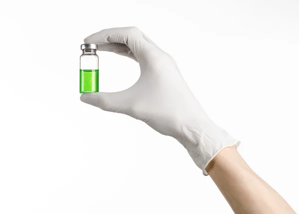 Medical theme: doctor's hand in a white glove holding a green vial of liquid for injection isolated on white background — Stock Photo, Image