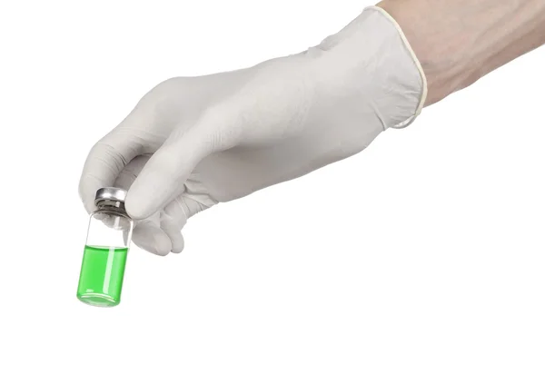 Medical theme: doctor's hand in a white glove holding a green vial of liquid for injection isolated on white background — Stock Photo, Image