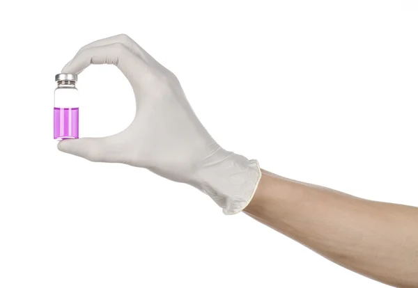 Medical theme: doctor's hand in a white glove holding a purple vial of liquid for injection isolated on white background — Stock Photo, Image