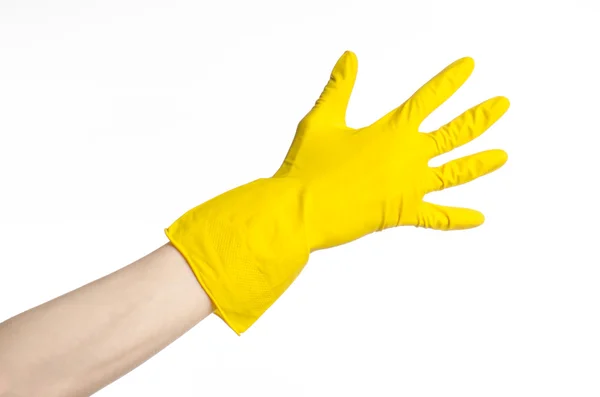 Tareas, lavado y limpieza del tema: la mano del hombre sostiene un amarillo y usa guantes de goma para limpiar aislado sobre fondo blanco en el estudio —  Fotos de Stock