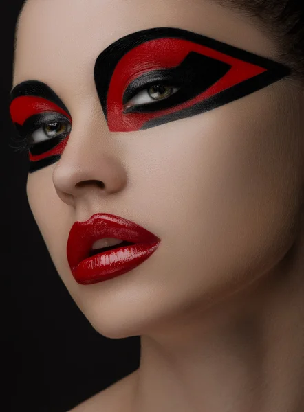 Red lips Black makeup on the eyes of the mask Women Beauty — Stock Photo, Image