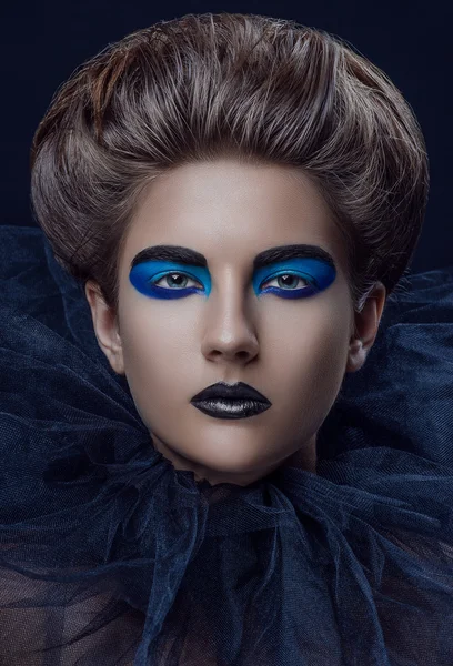 Girl black blue makeup grid laid up hair — Stock Photo, Image