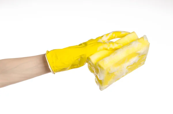 Cleaning the house and sanitation topic: Hand holding a yellow sponge wet with foam isolated on a white background in studio — Stock Photo, Image