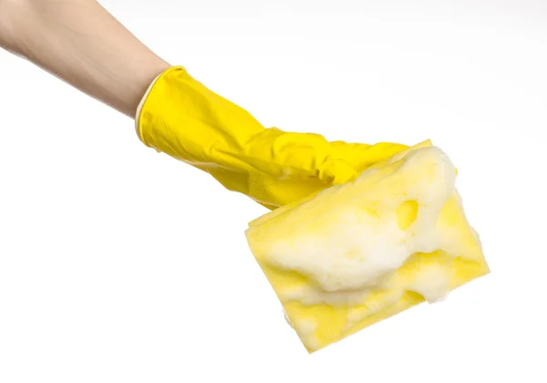 Cleaning the house and sanitation topic: Hand holding a yellow sponge wet with foam isolated on a white background in studio — Stock Photo, Image