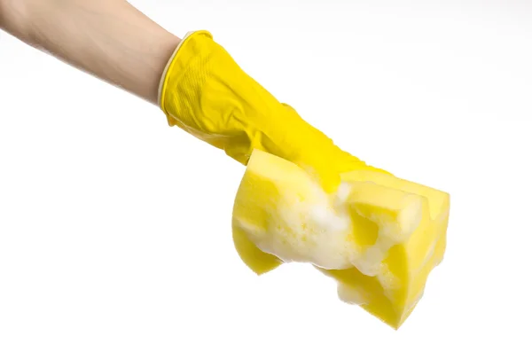 Cleaning the house and sanitation topic: Hand holding a yellow sponge wet with foam isolated on a white background in studio — Stock Photo, Image