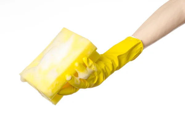 Cleaning the house and sanitation topic: Hand holding a yellow s — Stock Photo, Image