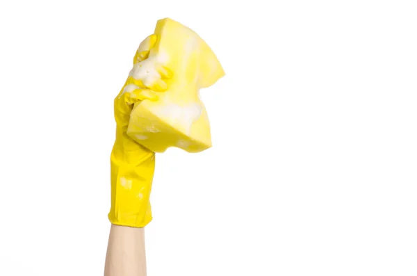 Cleaning the house and sanitation topic: Hand holding a yellow sponge wet with foam isolated on a white background in studio — Stock Photo, Image