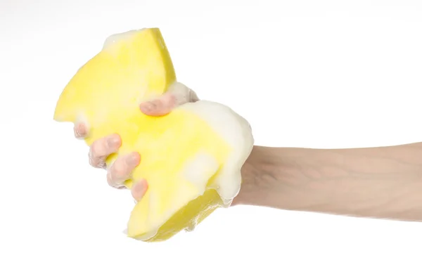 Cleaning the house and sanitation topic: Hand holding a yellow s — Stock Photo, Image