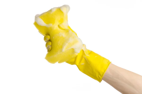 Cleaning the house and sanitation topic: Hand holding a yellow sponge wet with foam isolated on a white background in studio — Stock Photo, Image