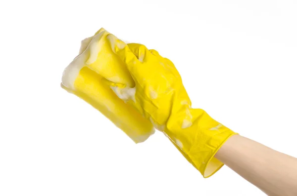 Cleaning the house and sanitation topic: Hand holding a yellow sponge wet with foam isolated on a white background in studio — Stock Photo, Image