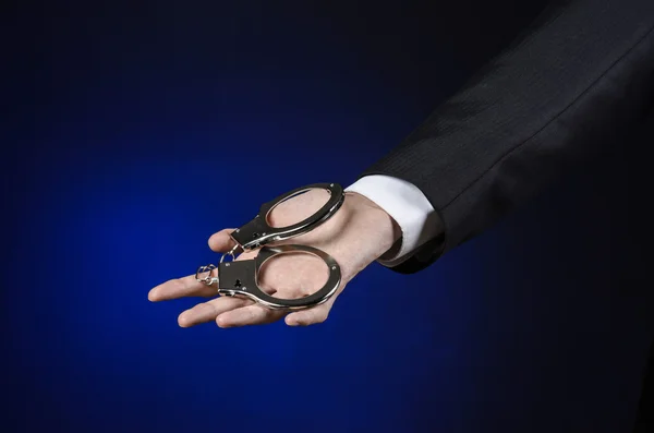 Corruption and bribery theme: businessman in a black suit with h — Stock Photo, Image