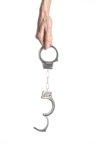 Prison and convicted topic: man hands with handcuffs isolated on white background in studio, put handcuffs on killer — Stock Photo, Image