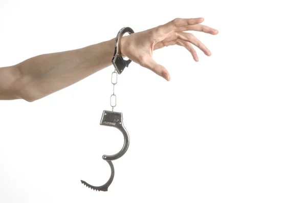 Prison and convicted topic: man hands with handcuffs isolated on white background in studio, put handcuffs on killer — Stock Photo, Image