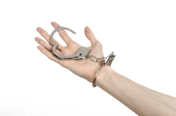 Prison and convicted topic: man hands with handcuffs isolated on white background in studio, put handcuffs on killer — Stock Photo, Image