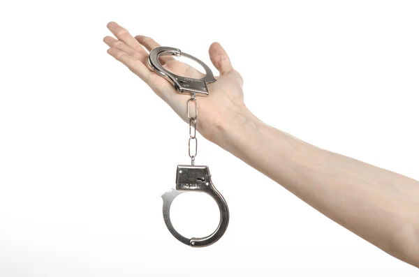 Prison and convicted topic: man hands with handcuffs isolated on white background in studio, put handcuffs on killer — Stock Photo, Image