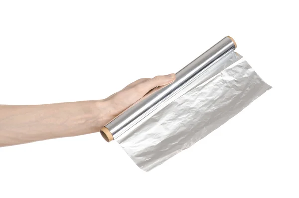 Koken en shisha onderwerp: menselijke hand met een folie geïsoleerd op een witte achtergrond in studio — Stockfoto