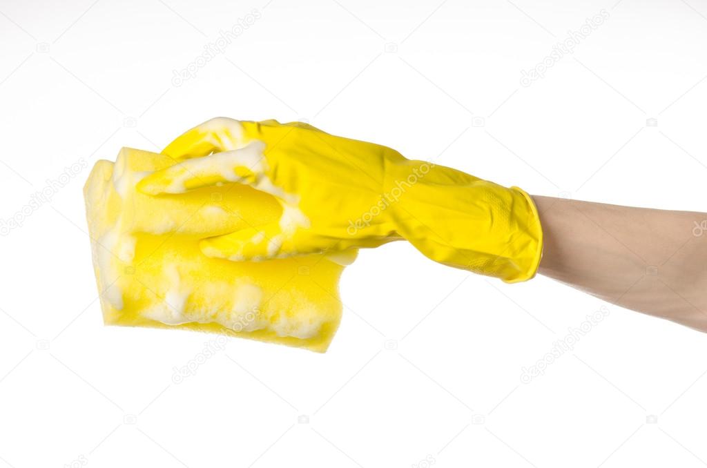 Cleaning the house and sanitation topic: Hand holding a yellow s