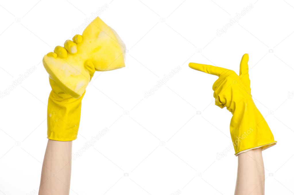 Cleaning the house and sanitation topic: Hand holding a yellow sponge wet with foam isolated on a white background in studio