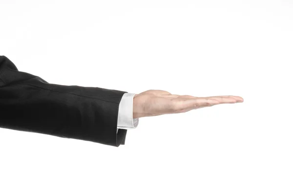 Businessman and gesture topic: a man in a black suit and white shirt showing hand gesture on an isolated white background in studio — Stock Photo, Image