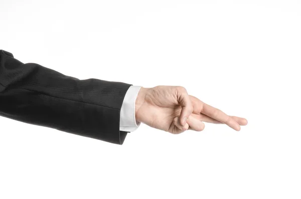 Businessman and gesture topic: a man in a black suit and white shirt showing hand gesture on an isolated white background in studio — Stock Photo, Image